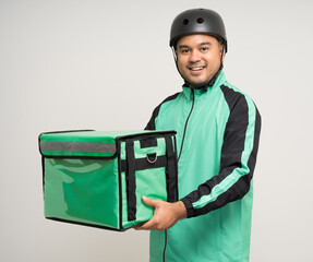 Young asian rider wearing green jacket uniform and bike helmet various action with delivery box. Male delivery service worker. Courier and shipping food service to customer online application