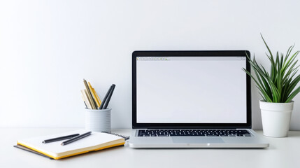 Online learning session setup with laptop, notebook, and stationery