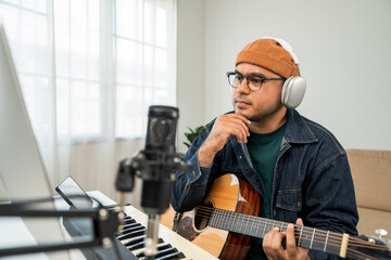 Professional Musician with condenser microphone and tablet for Mixing Mastering music. Music...