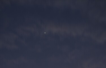 venus star on twilight blue sky with dark cloud in evening © pedphoto36pm