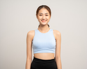 Young beautiful smiling asian woman with sportswear on isolated white background. Portrait happy healthy slim fit and firm attractive sporty woman standing pose exercise workout in studio.