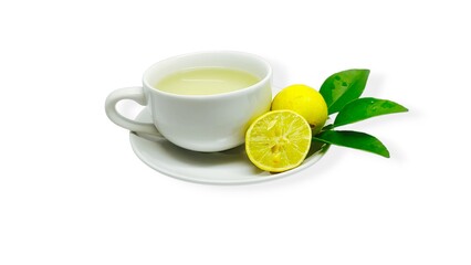 A cup of lemon wedang or lemon tea in a cup and saucer served with lemon slices on a white background. A cup of hot lemon juice for health.
