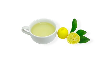 A cup of lemon wedang or lemon tea in a cup and saucer served with lemon slices on a white background. A cup of hot lemon juice for health.
