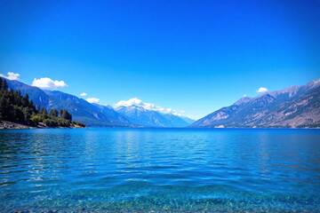 Naklejka premium Tranquil lake surrounded by majestic mountains