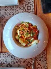Tipical Spanish food: Bravas chips, dices potatoes fried with spicy sauce.