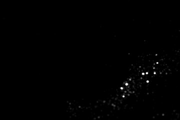 White gray blurred bokeh lights on black background