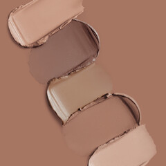 Mocha brown lipstick texture. Makeup smears on mocha mousse color background