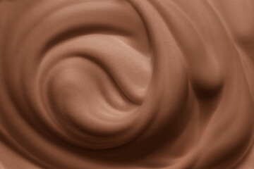 Mocha mousse texture background. Brown chocolate cream swirl close up