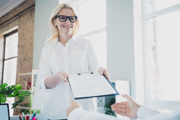 Photo of blonde executive assistant lady wearing formal white shirt and eyeglasses at office...