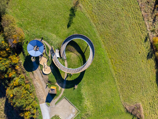 Spiral Observation Tower in a Scenic Green Landscape – Aerial View