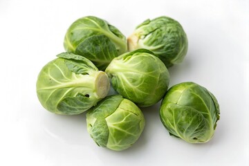 Fototapeta premium Fresh Brussels sprouts on a white background. Brussels sprouts are a typical winter vegetable.