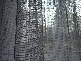 white decorative curtain in a home window