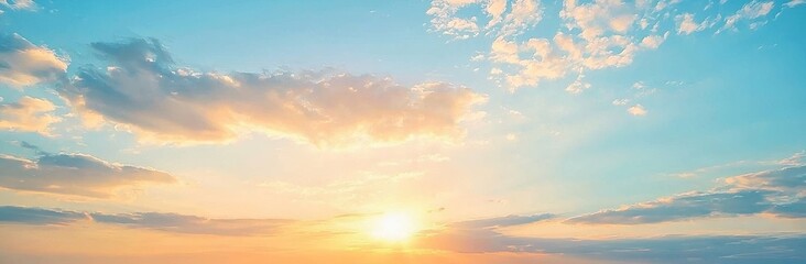 The sky is painted with an orange sunrise and soft clouds, creating a beautiful natural panorama.
