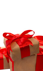 Beautifully wrapped gift boxes with red satin ribbons and bows, set on an isolated background. Perfect for parties and celebrations. 
