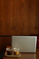 two cups of ice coffee on the wood table