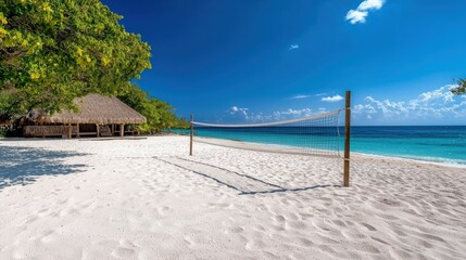 A sandy beach volleyball court with a net and a clear ocean view in the background.