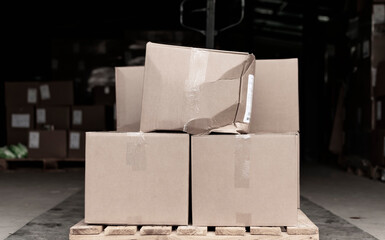 The packing box on the pallet with the goods is torn