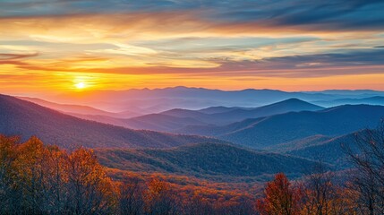 Fototapeta premium 2. A mountain range in the distance, with the first light of dawn casting a golden glow over the peaks.