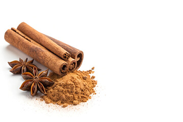 Cinnamon Sticks, Ground Cinnamon, and Star Anise on Left Side, Isolated on White Background with Copy Space