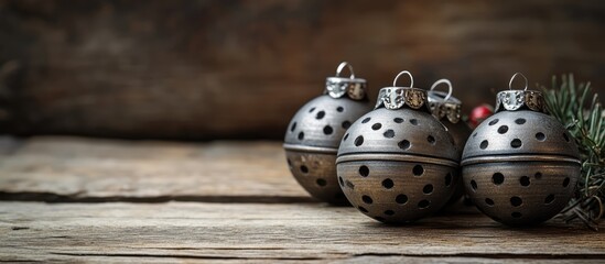 Rustic Christmas decorations featuring jingle bells on a wooden surface ideal for holiday-themed promotions and greeting cards.