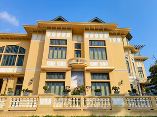 The beautiful yellow palace with green window at Bang Khun Phrom Palace, Bangkok.