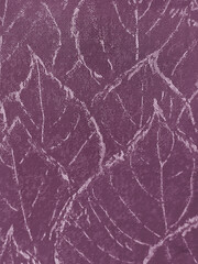 Fototapeta premium Close up of upholstery fabric in leaves pattern, in purple violet color. Seen the foliage leaves layers and its veins, seamless background texture.