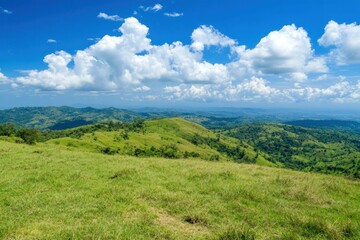 Fototapeta premium Stunning Green Hills Under Clear Blue Sky