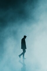 Obraz premium Solitary Figure Standing in a Minimalist Foggy Landscape, Representing Isolation, Contemplation, and the Quiet of Nature