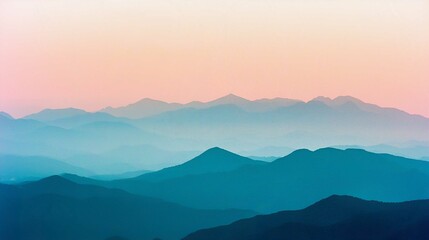 Misty Mountain Landscape at Sunrise with Fog and Clouds over the Valley