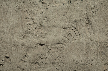 brown concrete wall with plaster close up
