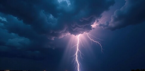 Obraz premium A dramatic view of a stormy day with dark grey clouds and flashes of lightning illuminating the black sky, dark clouds, electrical discharge