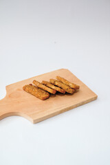Delicious fried tempeh or fried tempeh is ready to eat, with a white background.