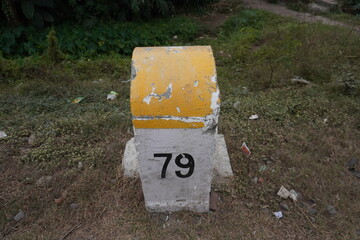Milestone for indicating the remaining distance of the place located beside the road