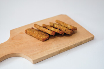 Delicious fried tempeh or fried tempeh is ready to eat, with a white background.