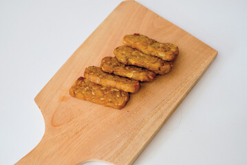 Delicious fried tempeh or fried tempeh is ready to eat, with a white background.