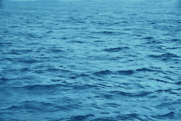 Blue ocean or sea waves. Repeating pattern. No horizon. Illustration from a photograph.