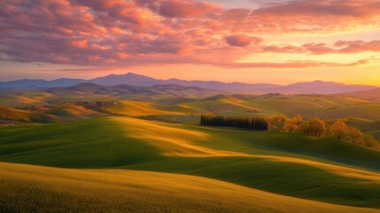 Obraz premium Serene Rolling Hills Under Colorful Sunset Sky in Tuscany Landscape