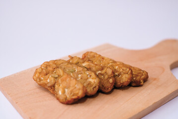 Delicious fried tempeh or fried tempeh is ready to eat, with a white background.