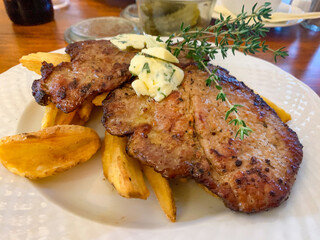 Roasted pork steaks from neck meat.