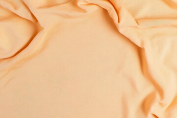 Top view of empty fabric in Peach Fuzz color, perfect for product display