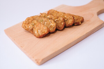 Delicious fried tempeh or fried tempeh is ready to eat, with a white background.