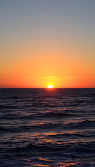 great sunset over the ocean, angled photoshot. isolated with white highlights