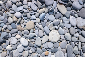 Background texture of sea pebbles, round small stones.