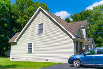 Suburban house architecture. Modern suburban house. Architecture concept. Home in suburb. Residential house. Private driveway. Suburban home in neighborhood. Private residential architecture with car