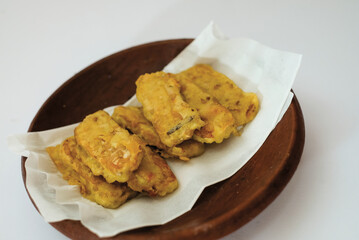 Delicious fried tempeh or fried tempeh is ready to eat, with a white background.