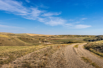 Approach grid road descending into Big Muddy Valley in Southern Saskatchewan, Canada
