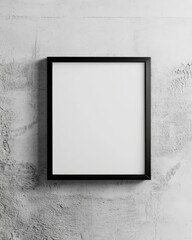 Minimalist black frame against a concrete wall, ideal for displaying art or photos in a contemporary setting.
