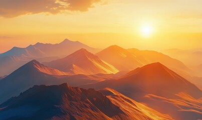 Obraz premium Golden sunrise over dramatic mountain peaks covered in warm light and soft mist