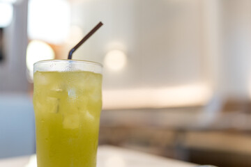 Refreshing cold ice green tea with straw