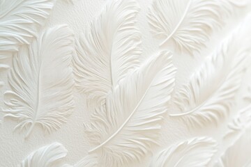 White embossed feather pattern on textured wall.